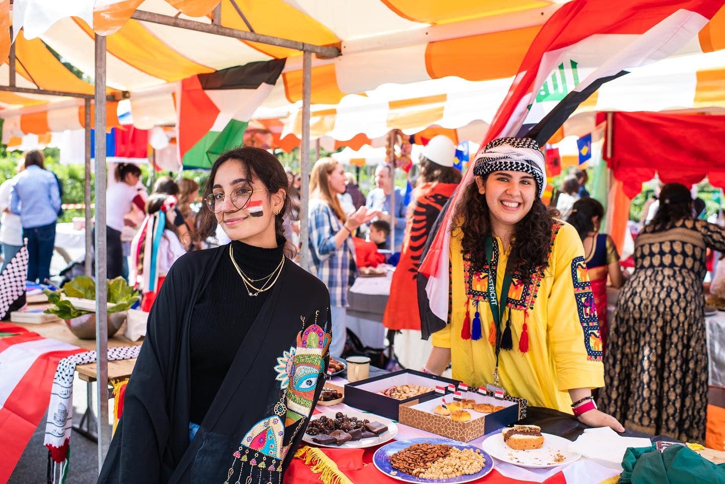 Students in international fair, smiling