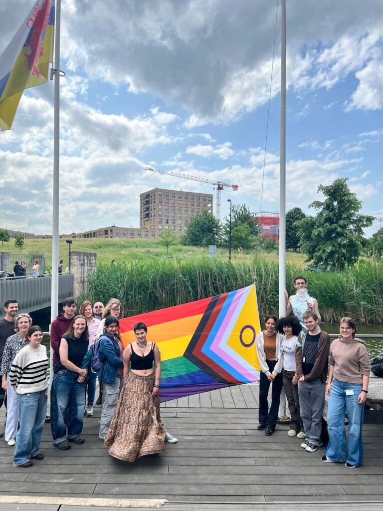 Students posing with flag